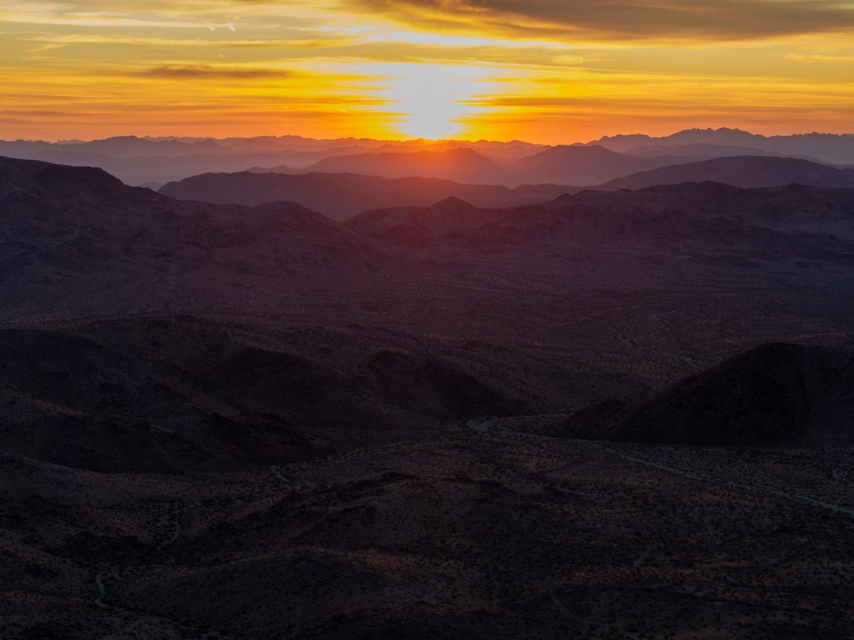In an aerial view, a view toward the east at sunrise is seen from above the Music Valley area where a large rare earth minerals mining is planned directly adjacent to Joshua Tree National Park