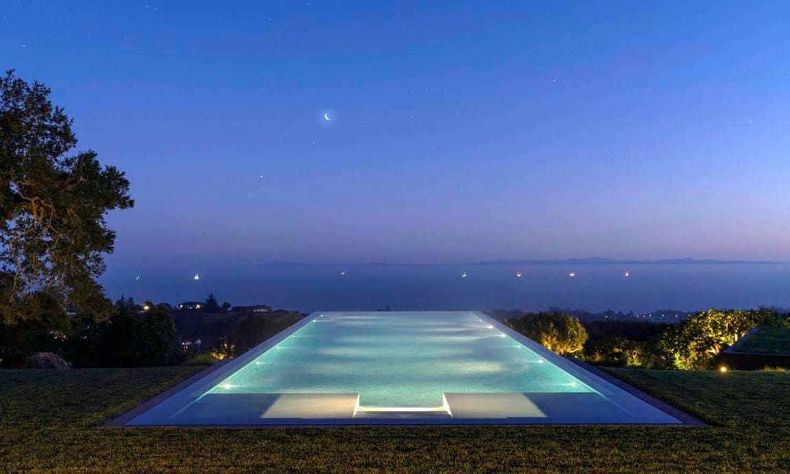 The infinity pool at night in the home of Ellen DeGeneres and Portia de Rossi that the couple just sold.