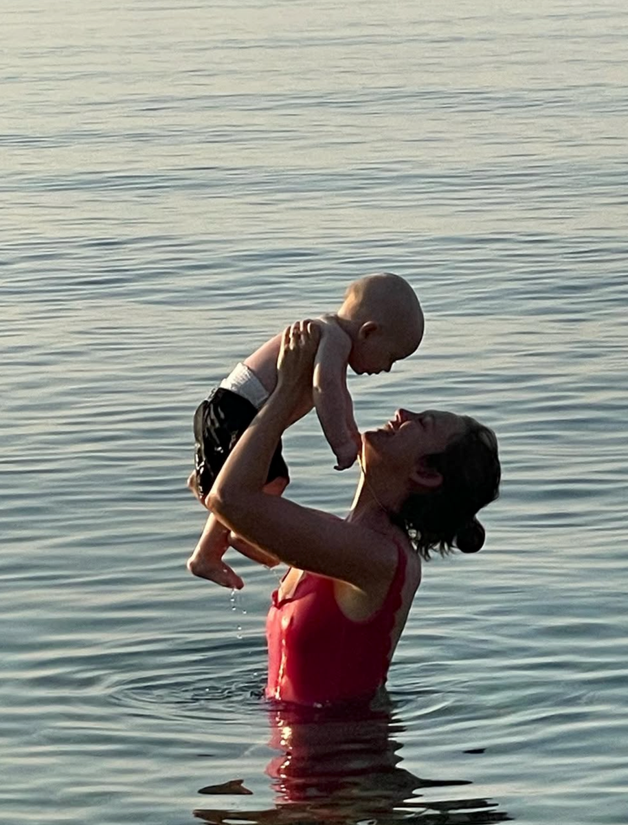 Eleonore von Habsburg shares a sweet moment with one of her children by the water. The mom of three has largely kept her children out of the public spotlight.