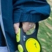 Kim walked alongside him with her small dog.