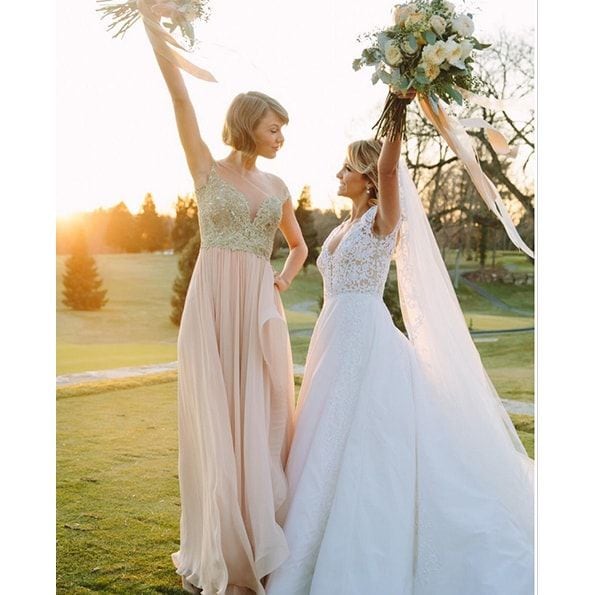 Maid of honor Taylor and her BFF Britany Maack both wore Reem Acra for Britany's February 2016 wedding.
<br>
Photo: Instagram/@taylorswift