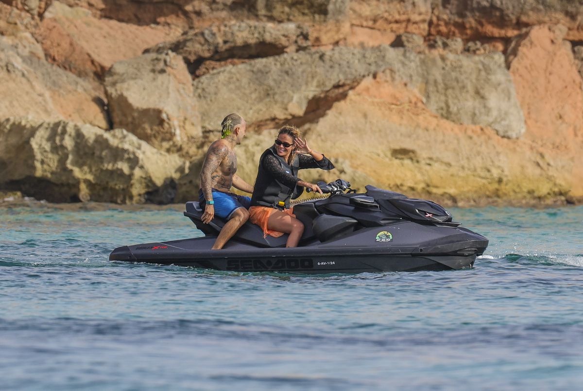 Karol G and her boyfriend, Feid, looked deeply in love as they shared kisses, rode a jet ski together, and soaked up the sun with friends aboard a luxurious yacht.