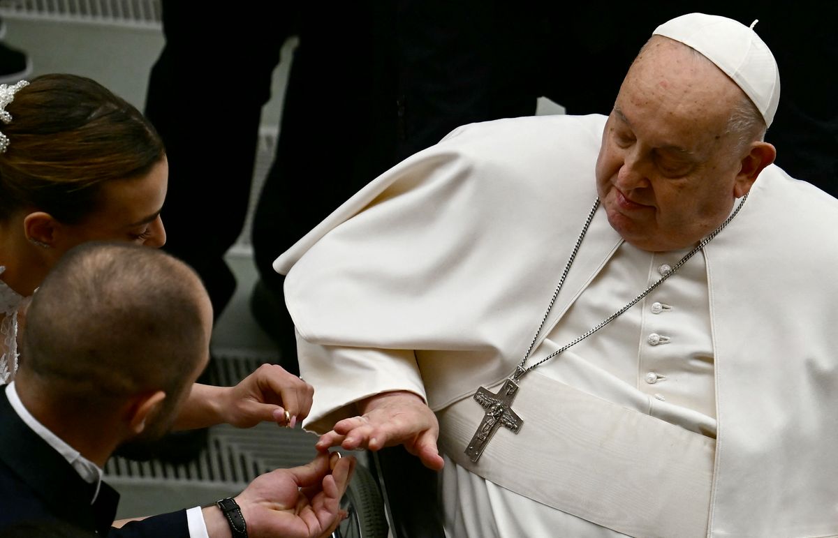Pope Francis blesses wedding rings during the weekly general audience on February 12, 2025 at Paul-VI hall in The Vatican. (Photo by Filippo MONTEFORTE / AFP) (Photo by FILIPPO MONTEFORTE/AFP via Getty Images)          