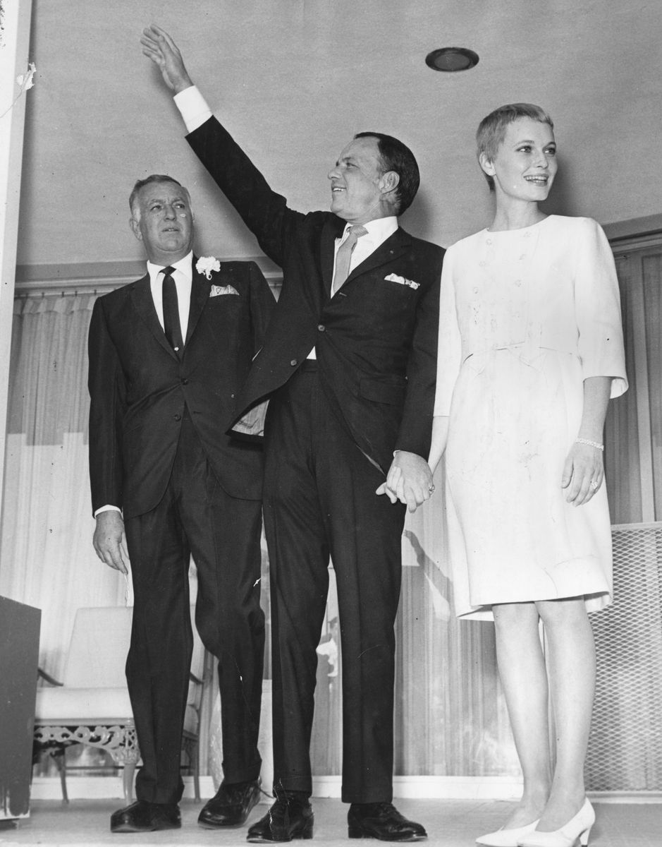 19th July 1966: American singer and actor Frank Sinatra and actress Mia Farrow after their wedding in Las Vegas.  