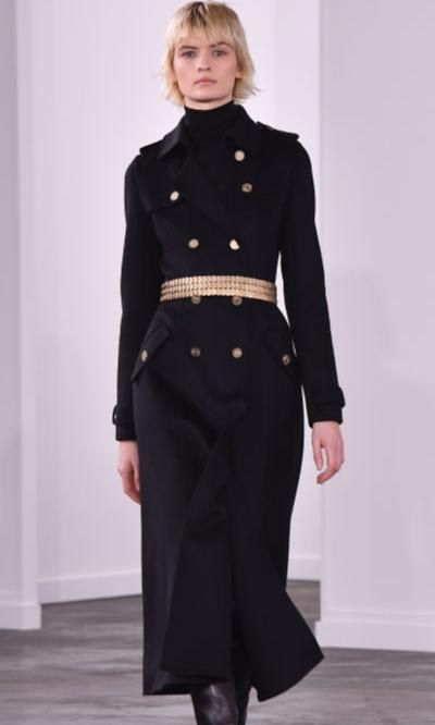 Gold belt over a black winter coat