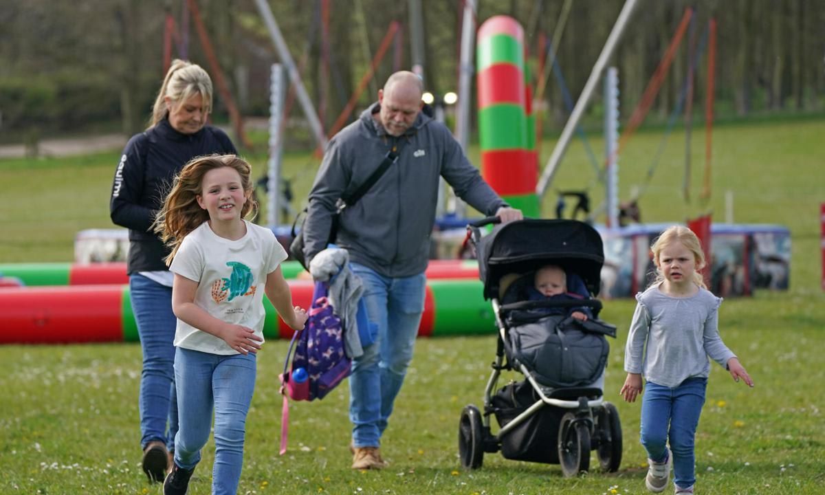 Mike had his hands full at the event on April 14 as he pushed Lucas in a stroller and carried a bag.