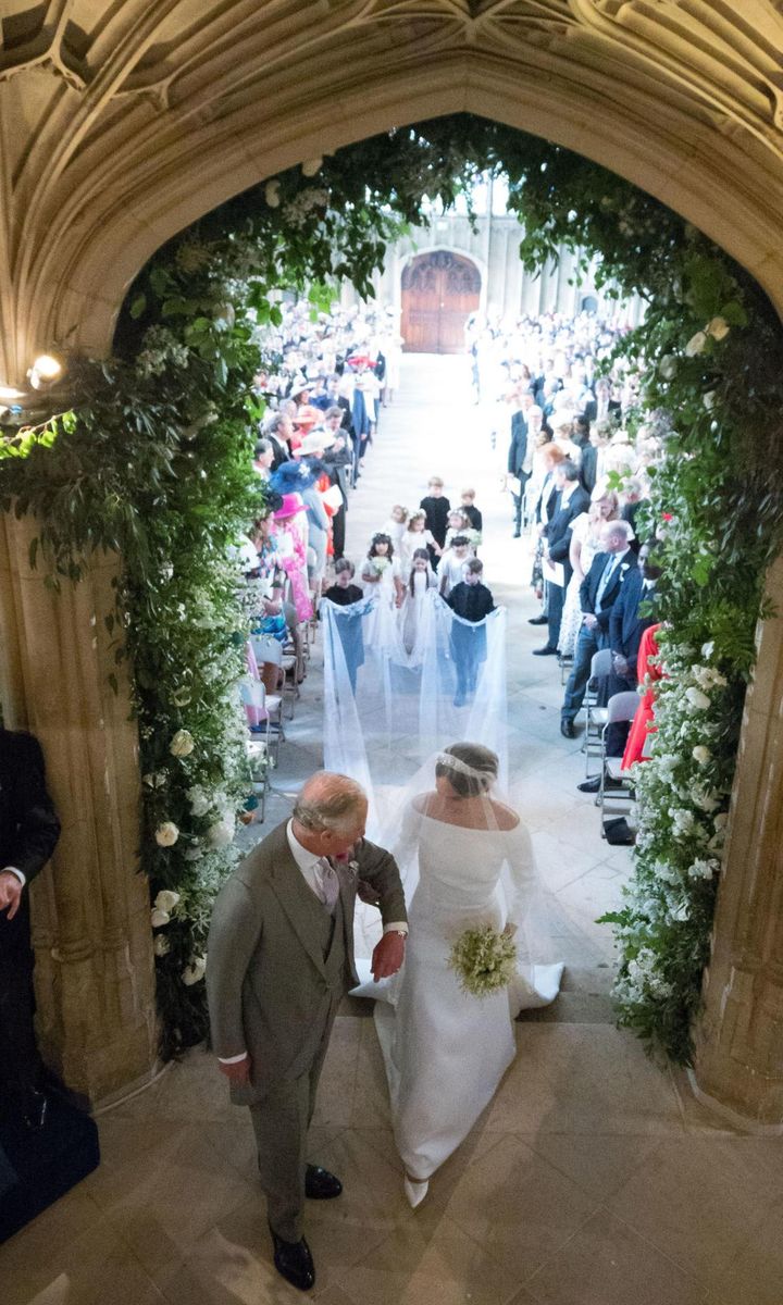Prince Charles walked his daughter in law Meghan Markle the second half of her journey to the altar