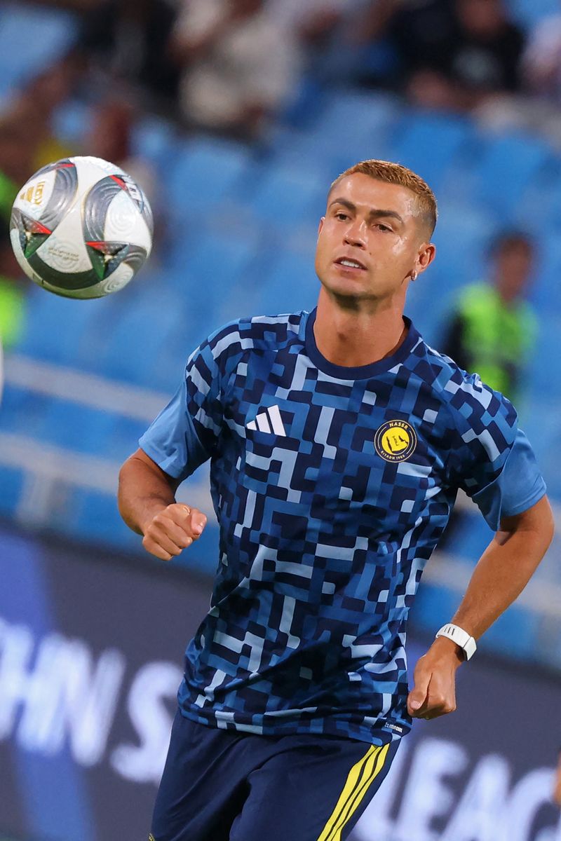 Nassr's Portuguese forward #07 Cristiano Ronaldo warms-up before the start of the Saudi Pro League football match