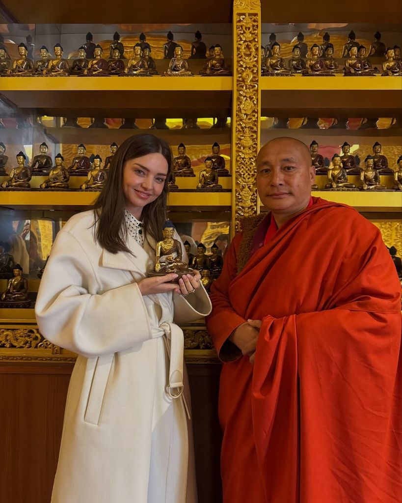 Miranda Kerr at a Buddhist shrine