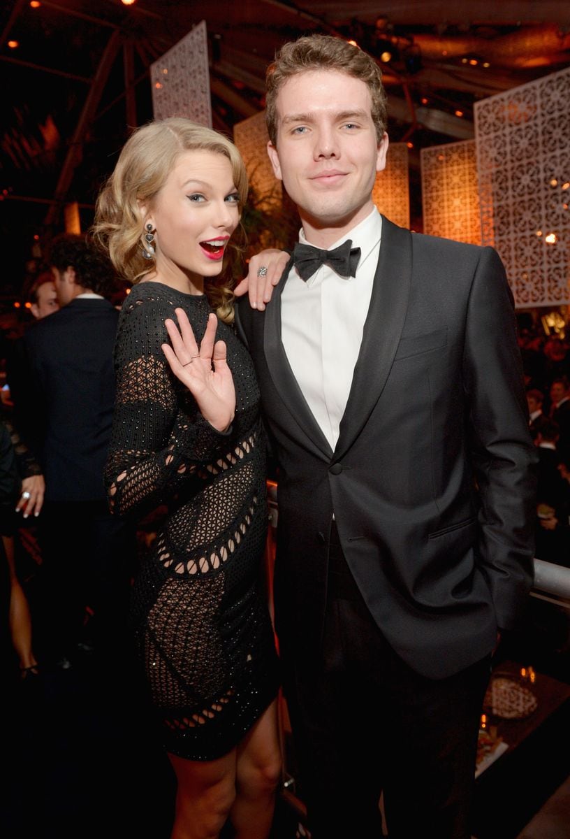 Taylor and Austin Swift at a Golden Globes After Party in 2014