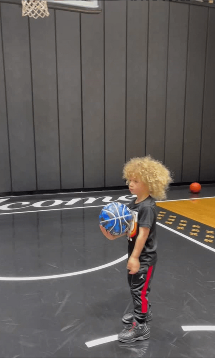 Drake proudly cheers on his 4 year old Adonis as he plays at their home basketball court
