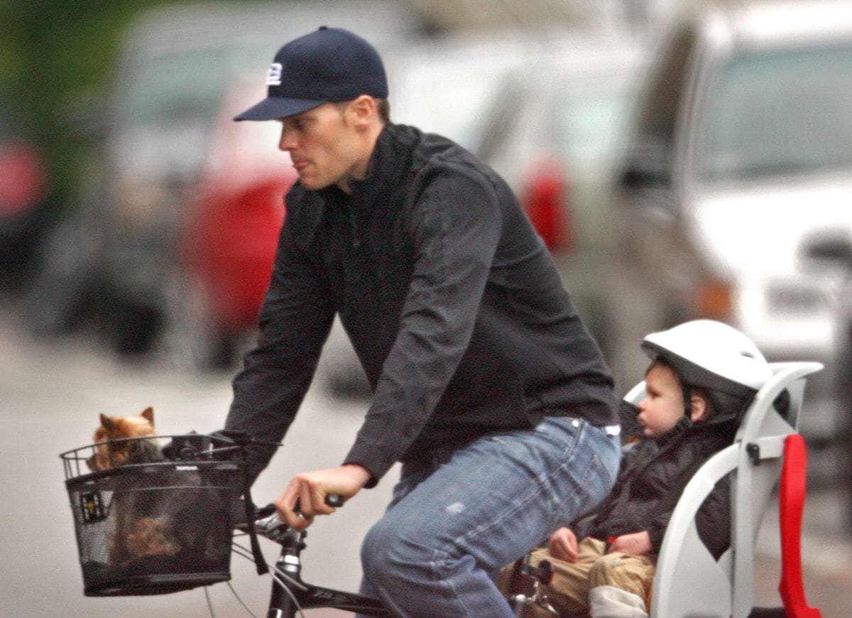 Tom Brady, his son Jack and his ex-wife Gisele's dog Vida enjoy an early evening Boston bike ride. Staff photo by Mark Garfinkel. (Photo by Mark Garfinkel/MediaNews Group/Boston Herald via Getty Images)