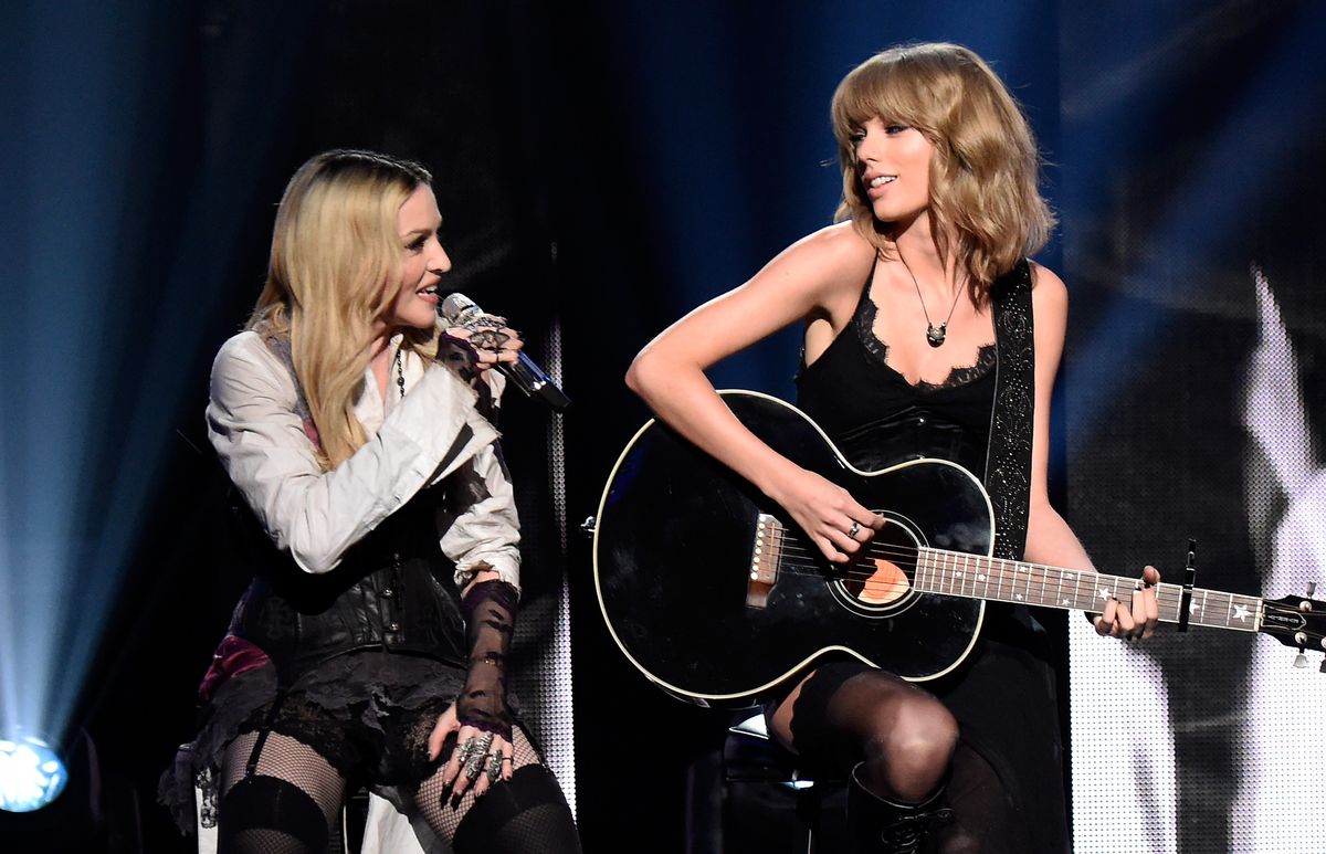 Singers Madonna (L) and Taylor Swift perform onstage during the 2015 iHeartRadio Music Awards on March 29, 2015
