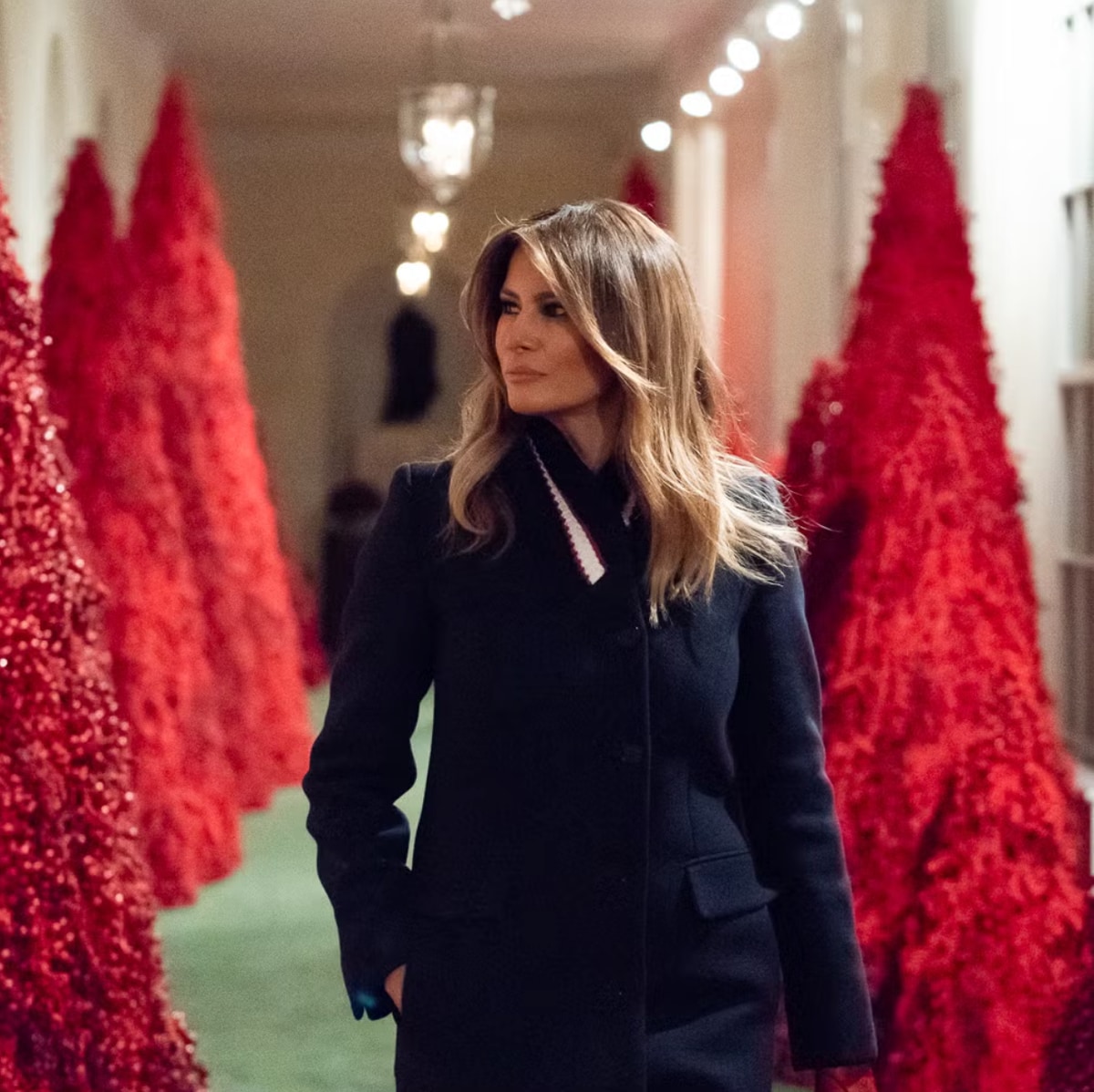 Melania's 2018 display of bold red trees, intended to symbolize American patriotism, but received mixed reactions.