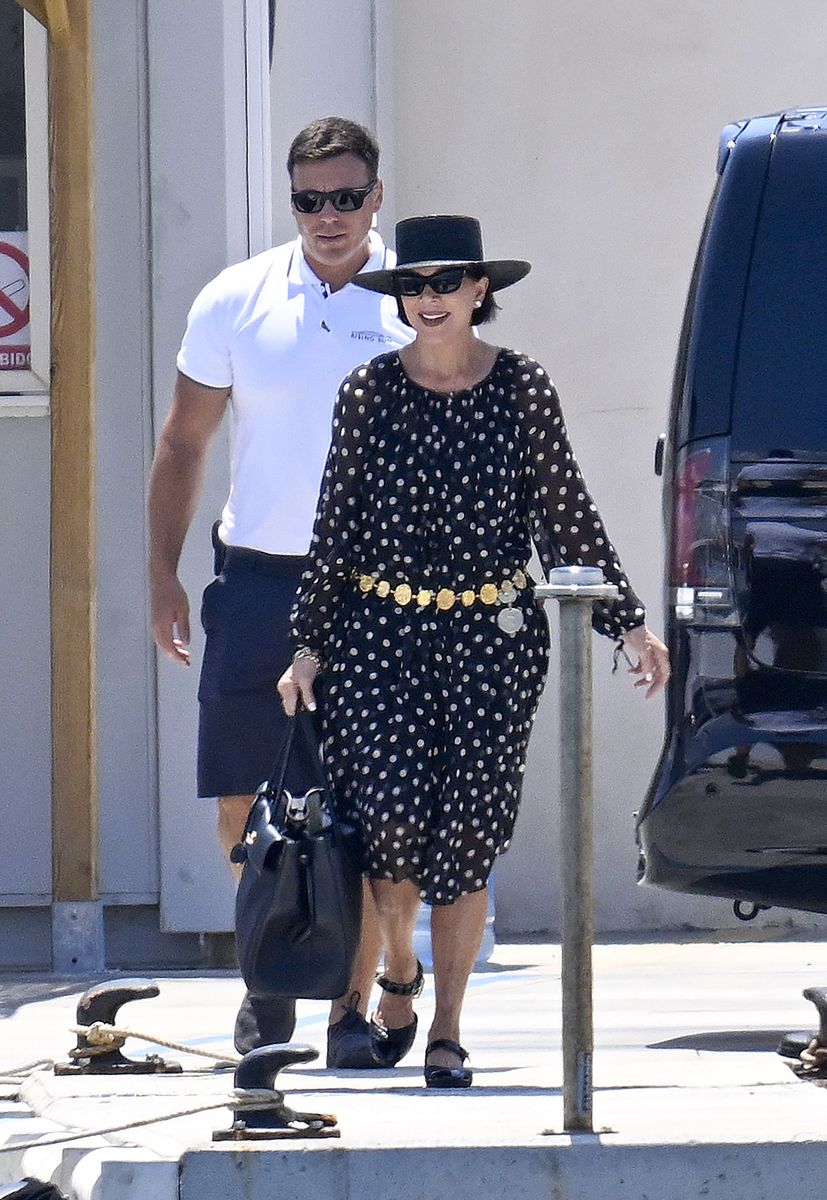 The reality television matriarch wore a black dress decorated with white polka dots, featuring voluminous long sleeves and a flowing silhouette. 
