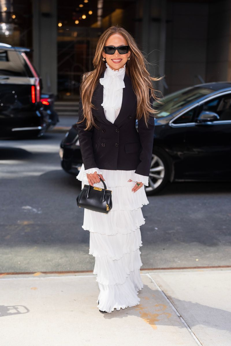 Rather than shying away from statement pieces, Lopez often leans into bold silhouettes, luxurious fabrics, dramatic accessories, and meticulously styled details.