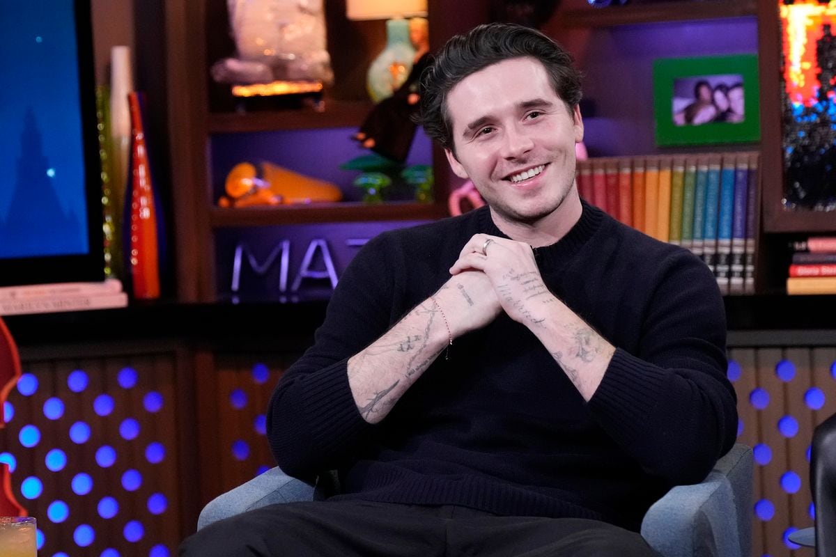 Brooklyn Beckham takes a spin on a vintage motorcycle as family drama escalates