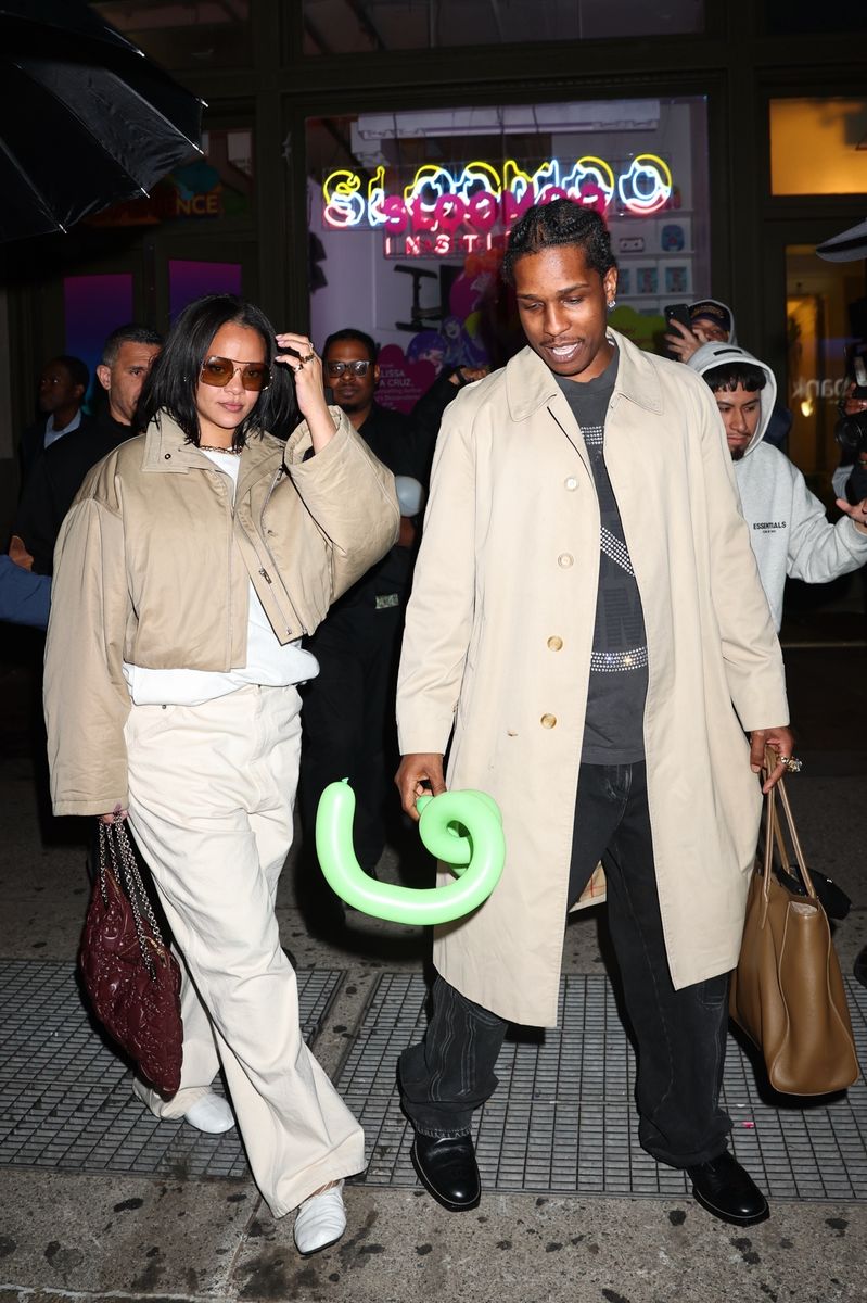 Rihanna wore a beige cropped jacket identified by fashion accounts as Miu Miu, oversized cream pants, and a vintage-style burgundy leather bag, while A Rocky wore a beige Burberry-style trench coat.