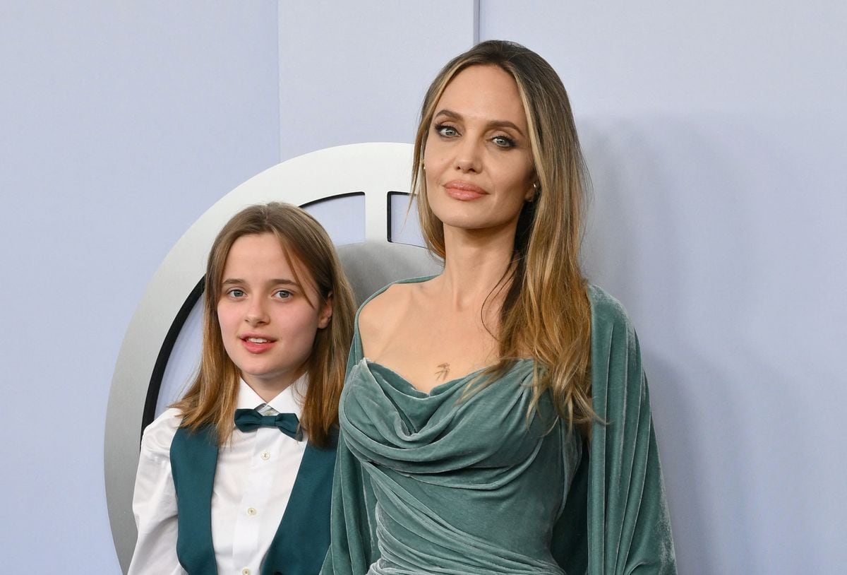 Angelina Jolie shows off chest tattoo with her daughter Vivienne by her side