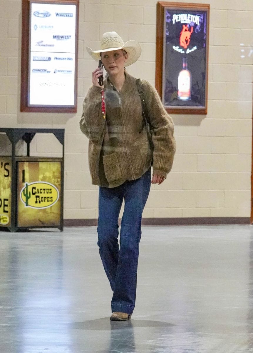 Hadid completed her outfit with a brown sweater