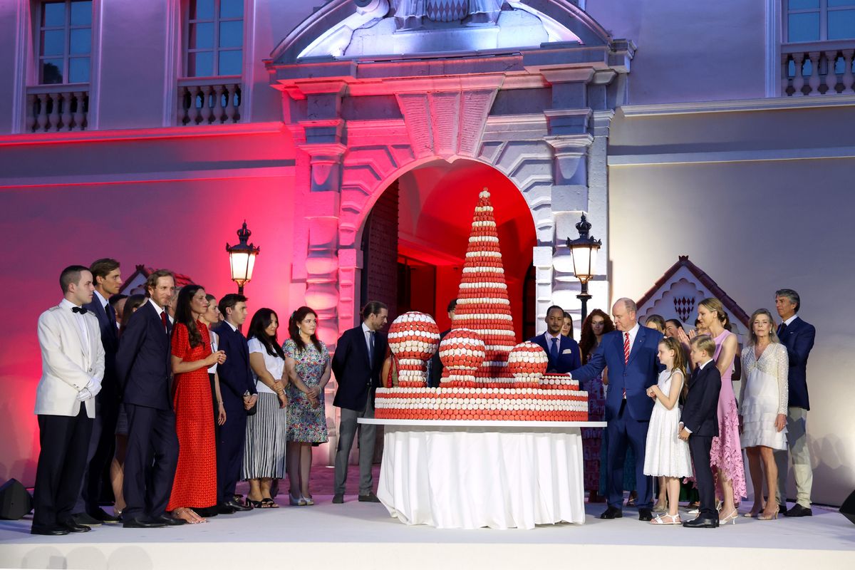 (L-R) Ben Sylvester Strautmann, Princess Alexandra of Hanover, Andrea Casiraghi, Tatiana Santo Domingo, Charlotte Casiraghi, Louis Ducruet, Marie Ducruet, Melanie Antoinette de Massy, Prince Albert II of Monaco, Princess Gabriella of Monaco, Princess Charlene of Monaco, Prince Jacques of Monaco and Princess Caroline of Hanover cut the cake