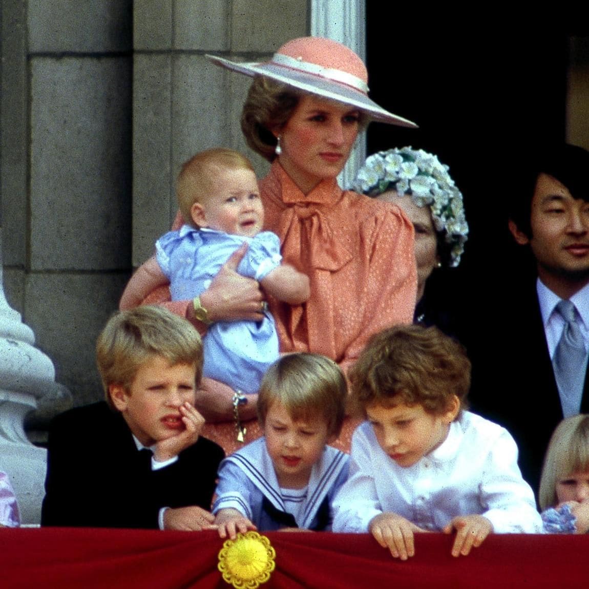 Something seemed to catch the boys' attention in 1985 as they peered over the balcony.