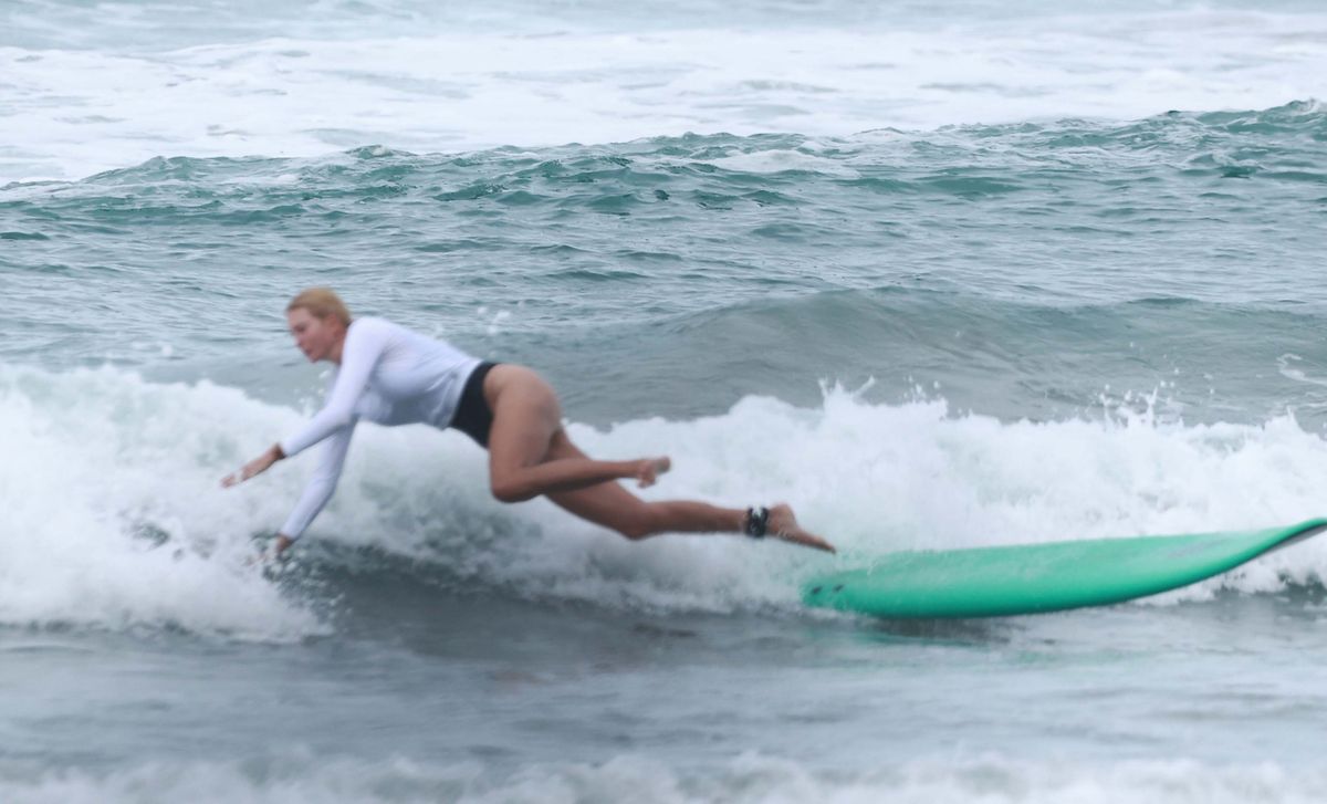 The former White House advisor took a tumble into the water, but quickly climbed back on her board to continue practicing.