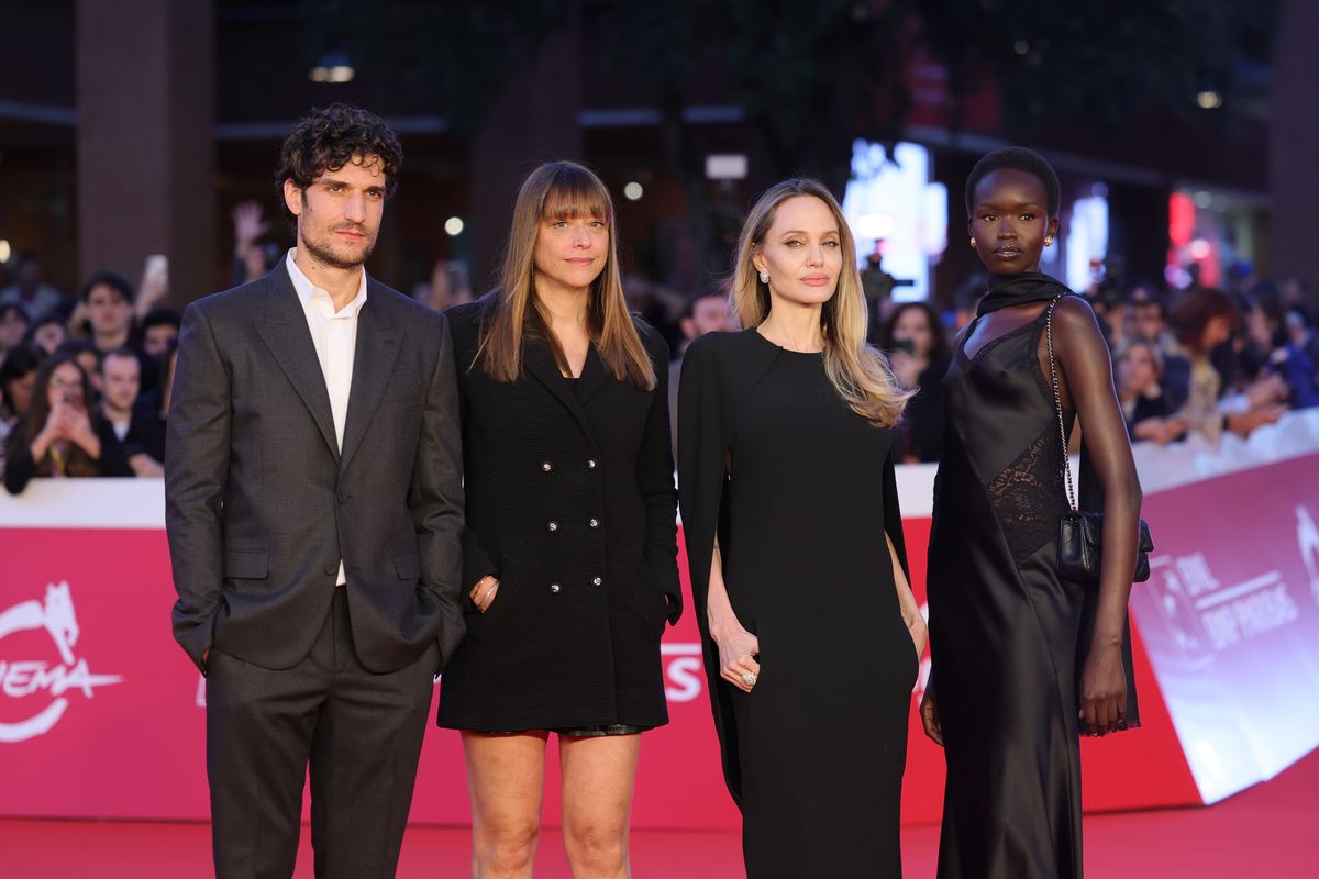 Louis Garrel, Alice Winocour, Angelina Jolie and Anyier Anei attend the "Couture" red carpet during the 20th Rome Film Festival 