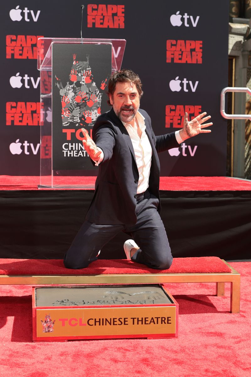 Javier Bardem smiles as he leaves his handprints and footprints in cement during a ceremony at the TCL Chinese Theatre in Hollywood.