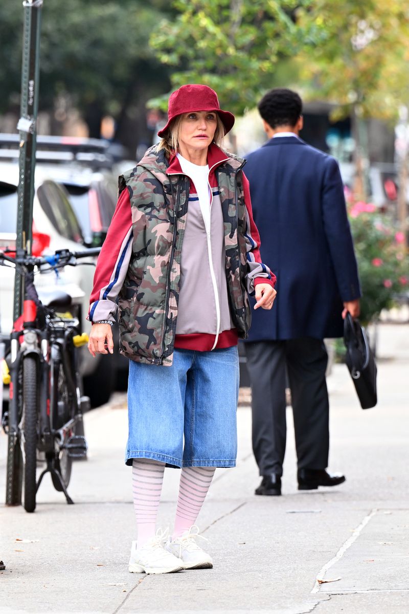 It’s not every day that you see Cameron Diaz sporting baggy jorts, knee-high striped socks, and a red bucket hat.