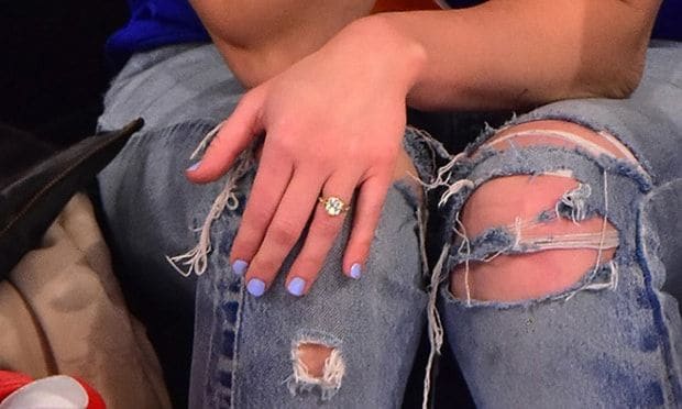 Miley was not shy about showing off her bling during the basketball game.
<br>
Photo: GC Images