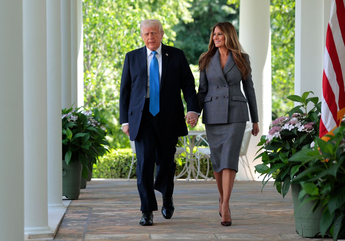 President Donald Trump and first lady Melania Trump arrive at the signing ceremony for the TAKE IT DOWN Act in the Rose Garden of the White House 