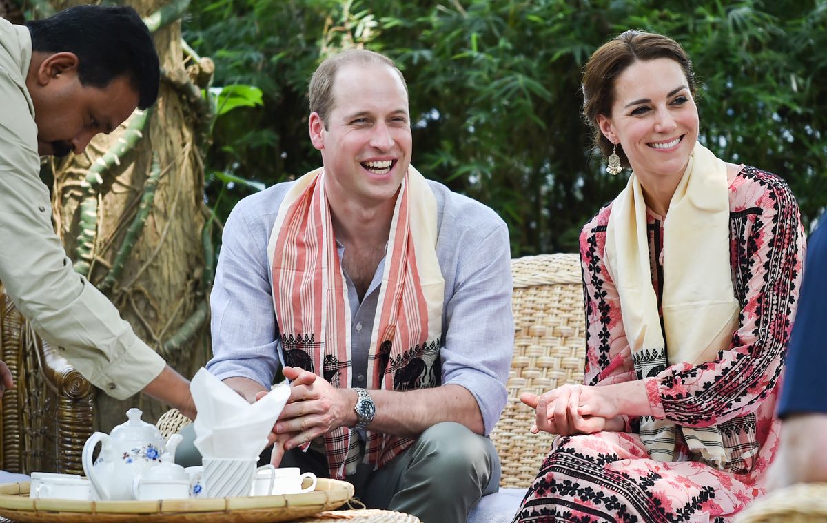 Prince William and Kate Middleton drinking a cup of tea as they visit the Centre for Wildlife Rehabilitation and Conservation at Kaziranga National in India in 2016