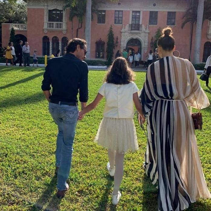 Marc Anthony and Jennifer Lopez hold hands with daughter Emme at school event