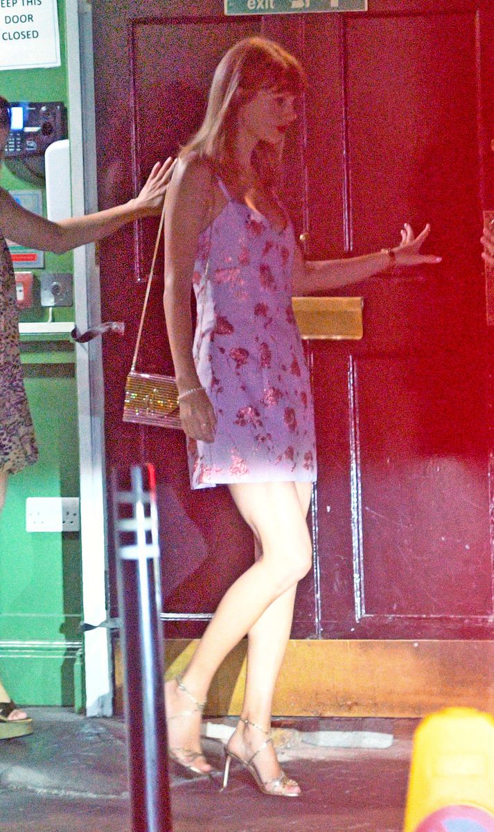 The star wore an elegant pink and purple dress as she stepped out in public for the first time since her recent wedding to Travis Kelce.