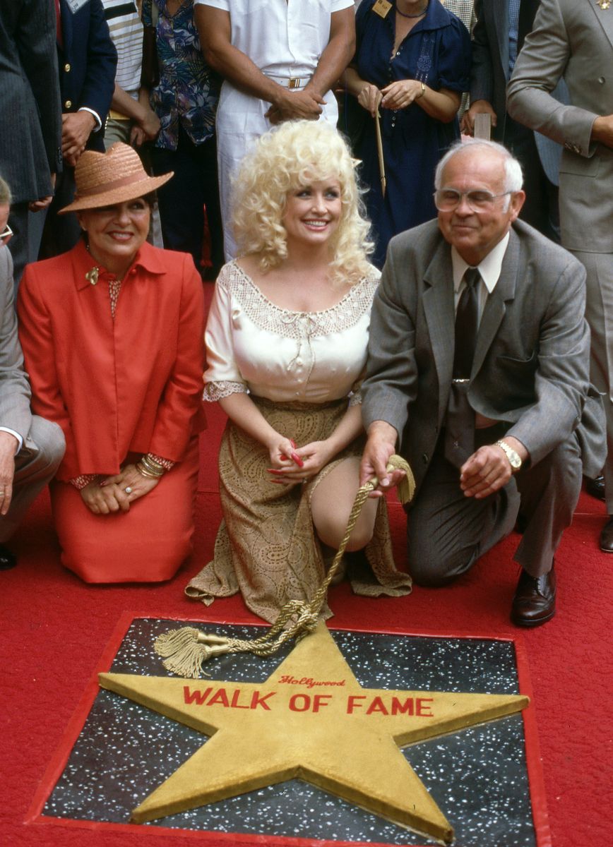 Dolly Parton with a Star on the Hollywood Walk of Fame at Walk of Fame in Hollywood, California, June 14, 1984