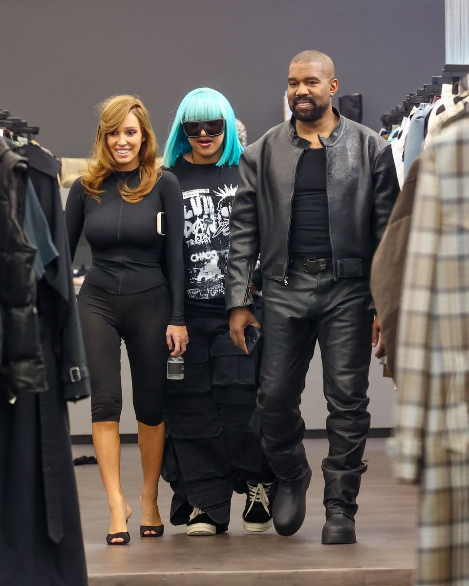 North's colorful hair ensured she remained the center of attention as the family browsed clothing racks inside the boutique.
