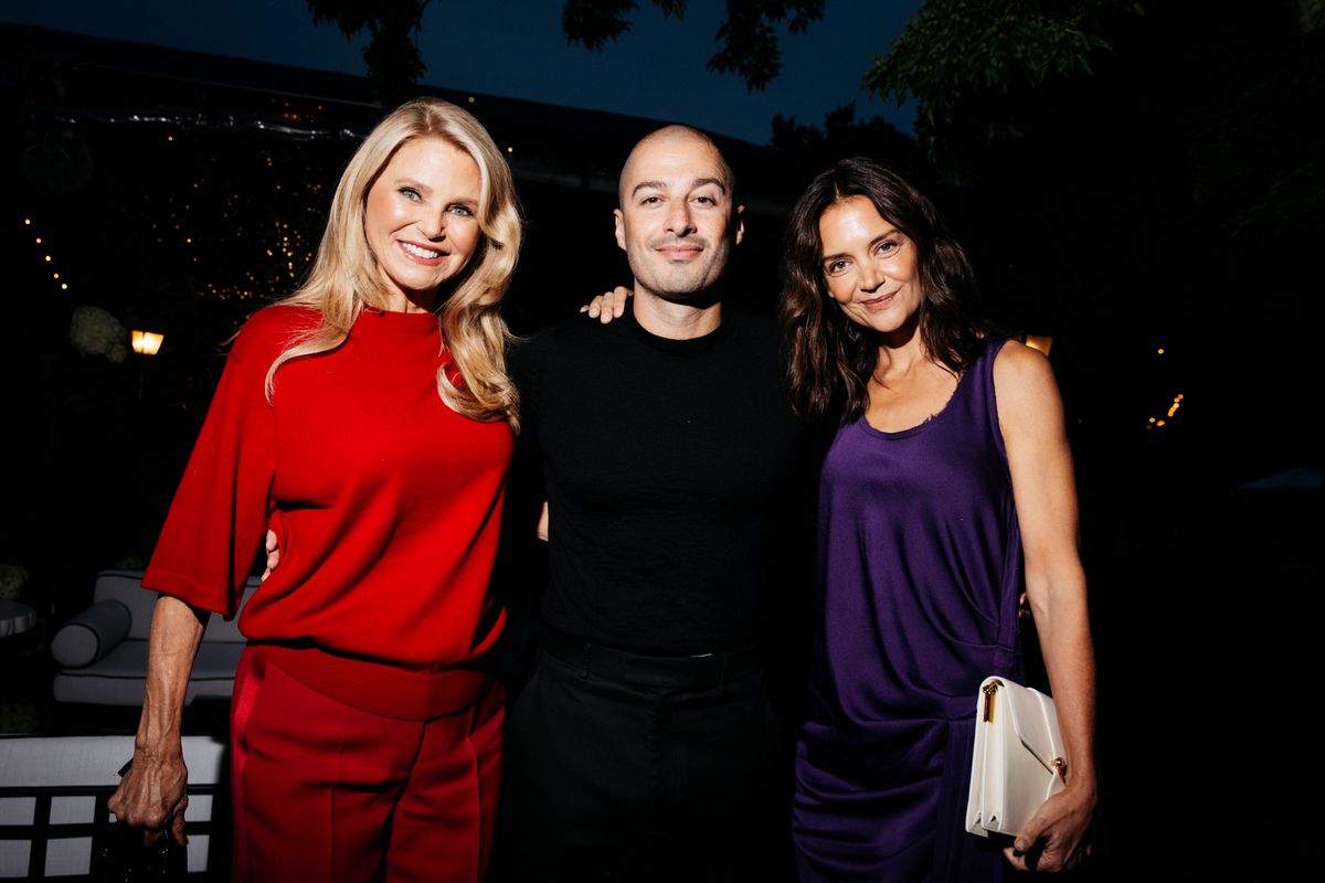 Christie Brinkley, Jason Bard Yarmosky and Katie Holmes at the Michael Kors 45th Anniversary Collection Dinner held at Swifty's at The Hedges Inn on August 20, 2026 in East Hampton, New York. (Photo by Lexie Moreland/WWD via Getty Images)