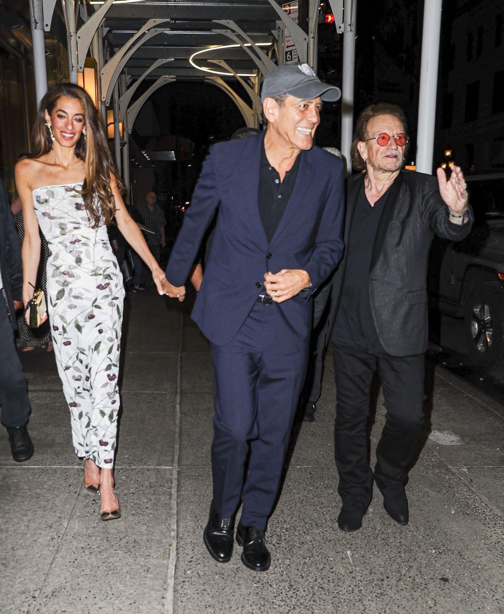 Amal Clooney shows off her summer style in cherry dress for date night with George Clooney