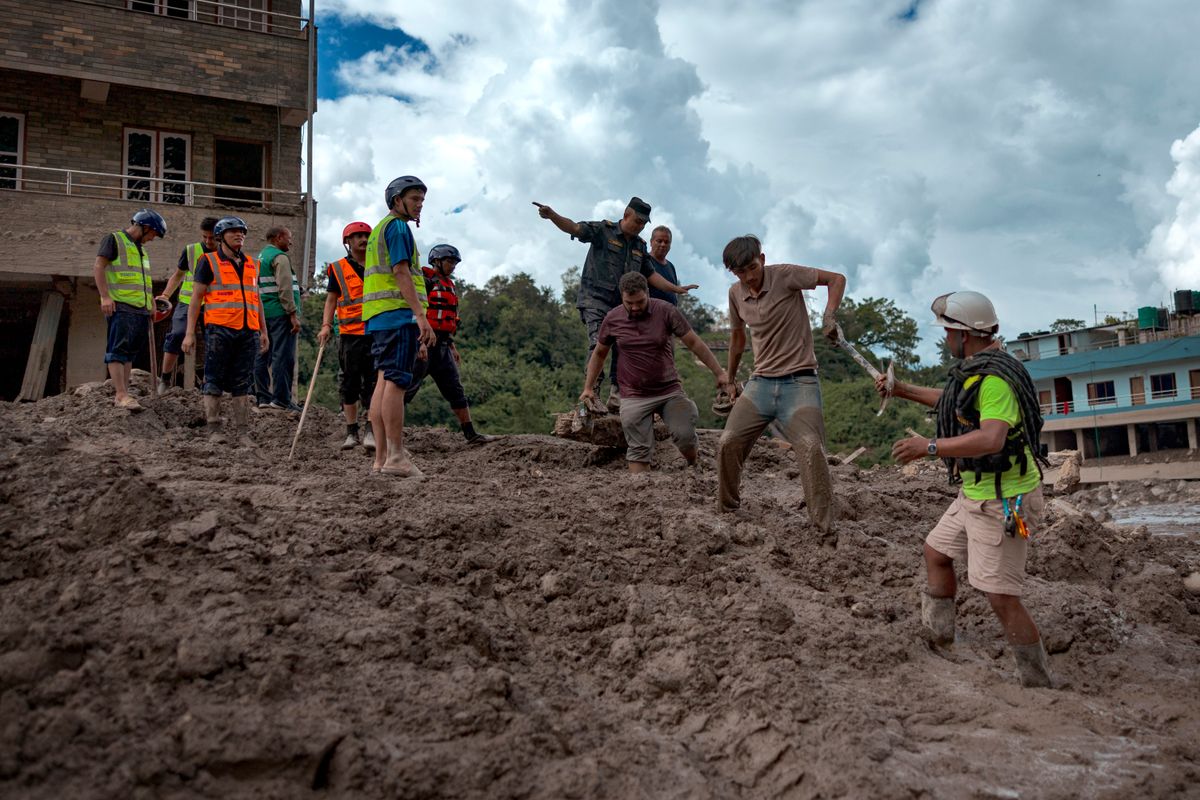 Homes and infrastructure were buried beneath mud and debris after powerful floodwaters tore through communities in Nepal.