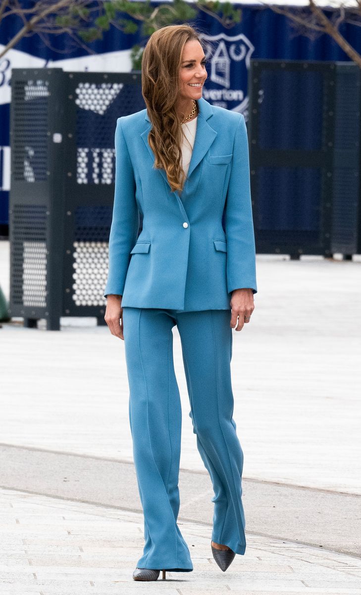 Kate Middleton paired a fitted blue jacket with high-waisted, flared trousers during her visit to Everton FC’s Hill Dickinson Stadium.