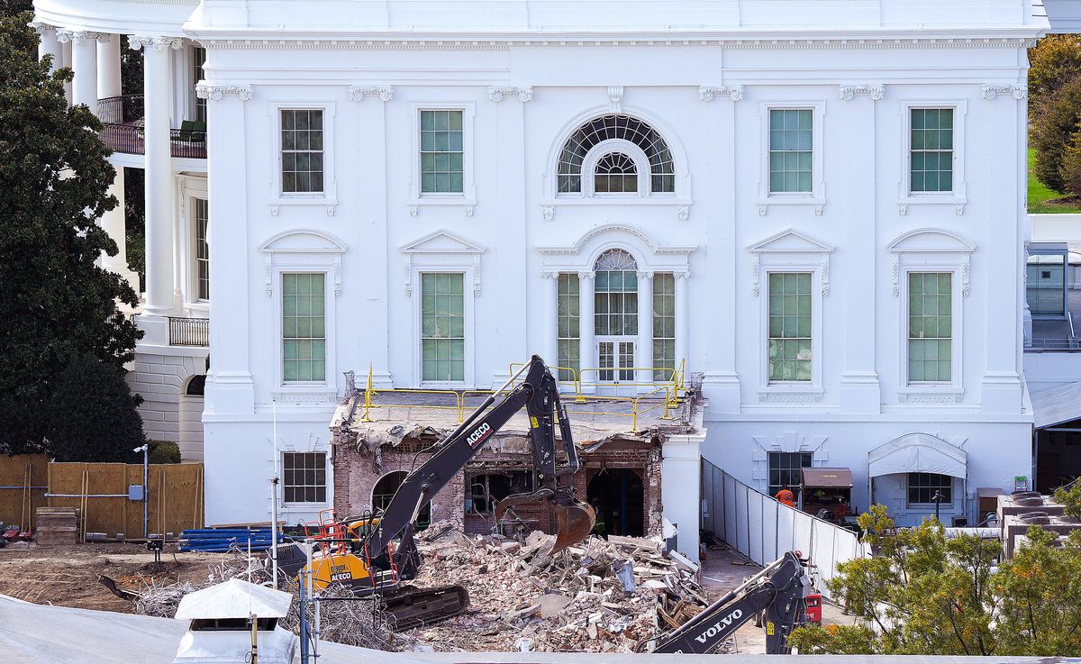 An excavator works to clear rubble after the East Wing of the White House was demolished 