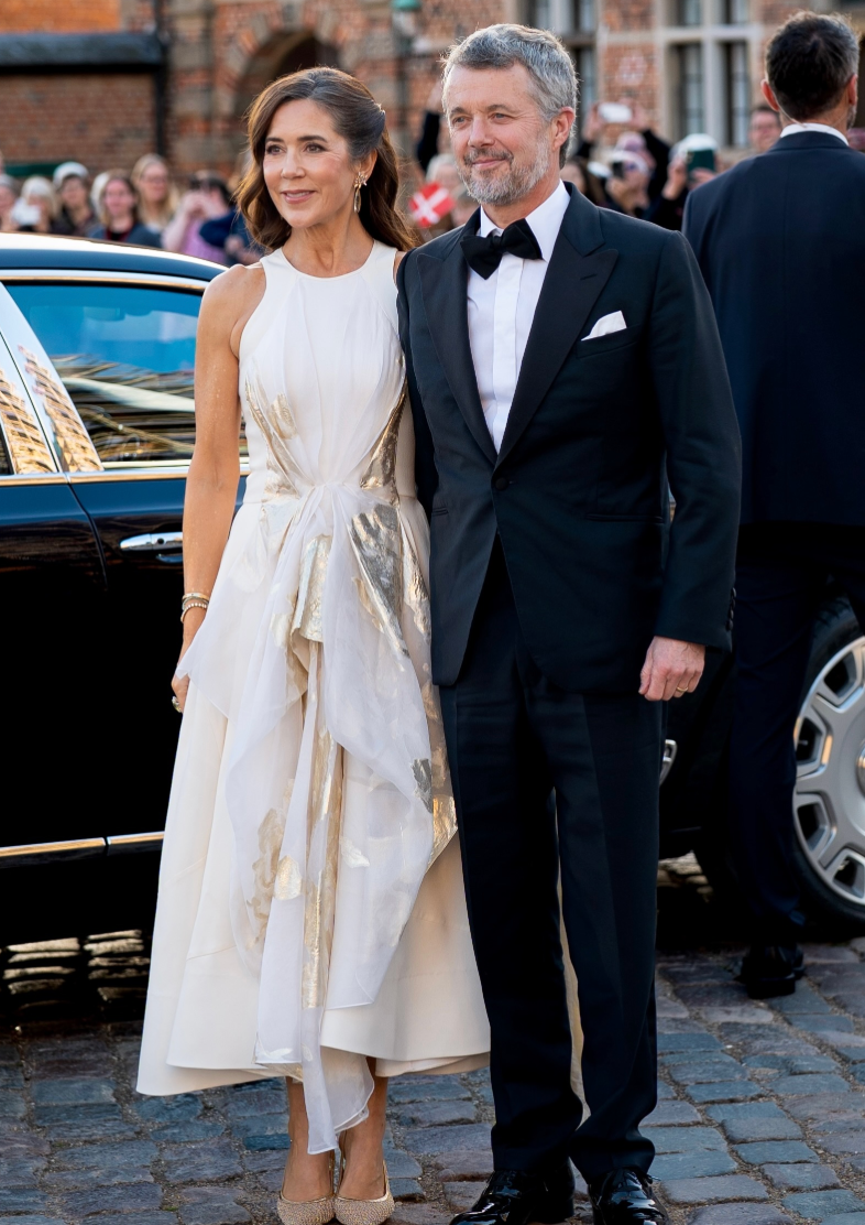 Queen Mary wore a white dress with shimmering gold details as she arrived with King Frederik at Frederiksborg Castle on September 25.
