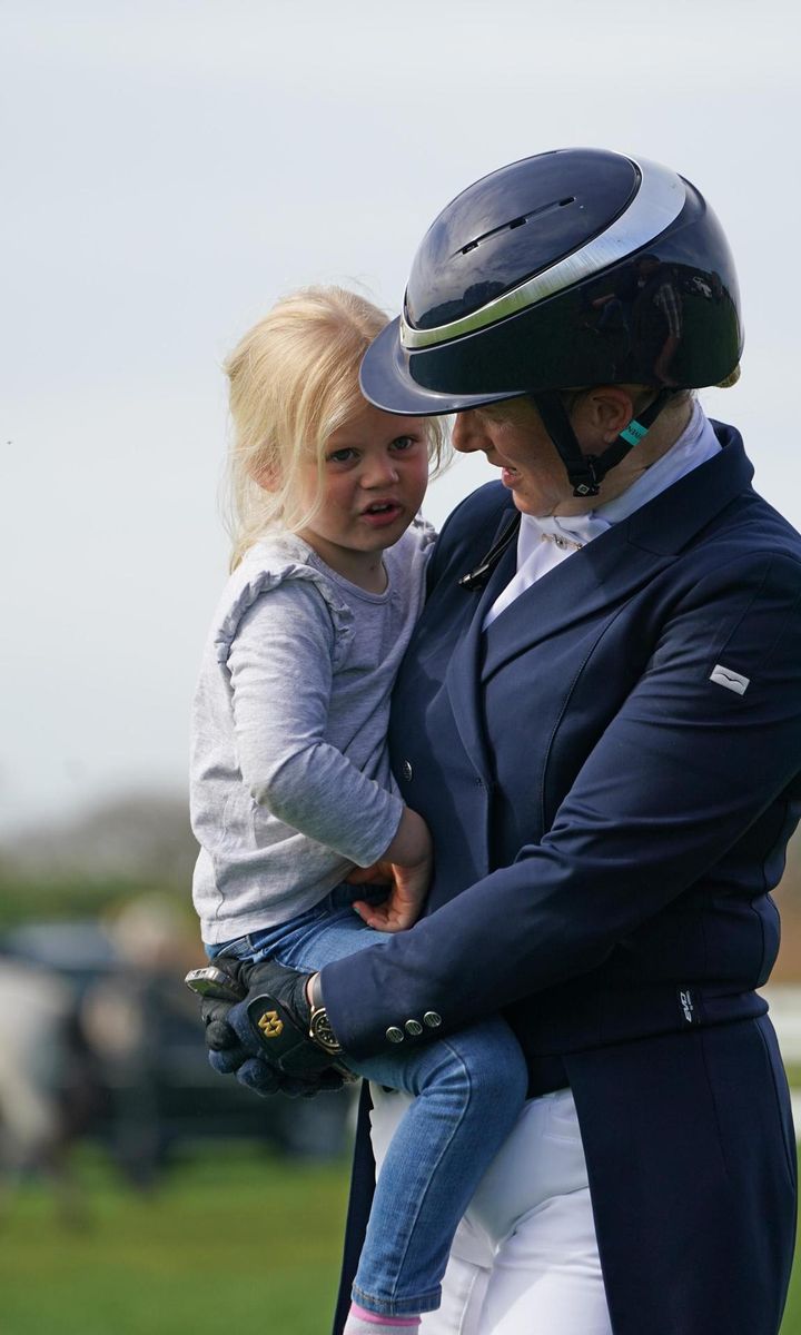 Lena, the couple's second child, got a lift from mom, Zara.