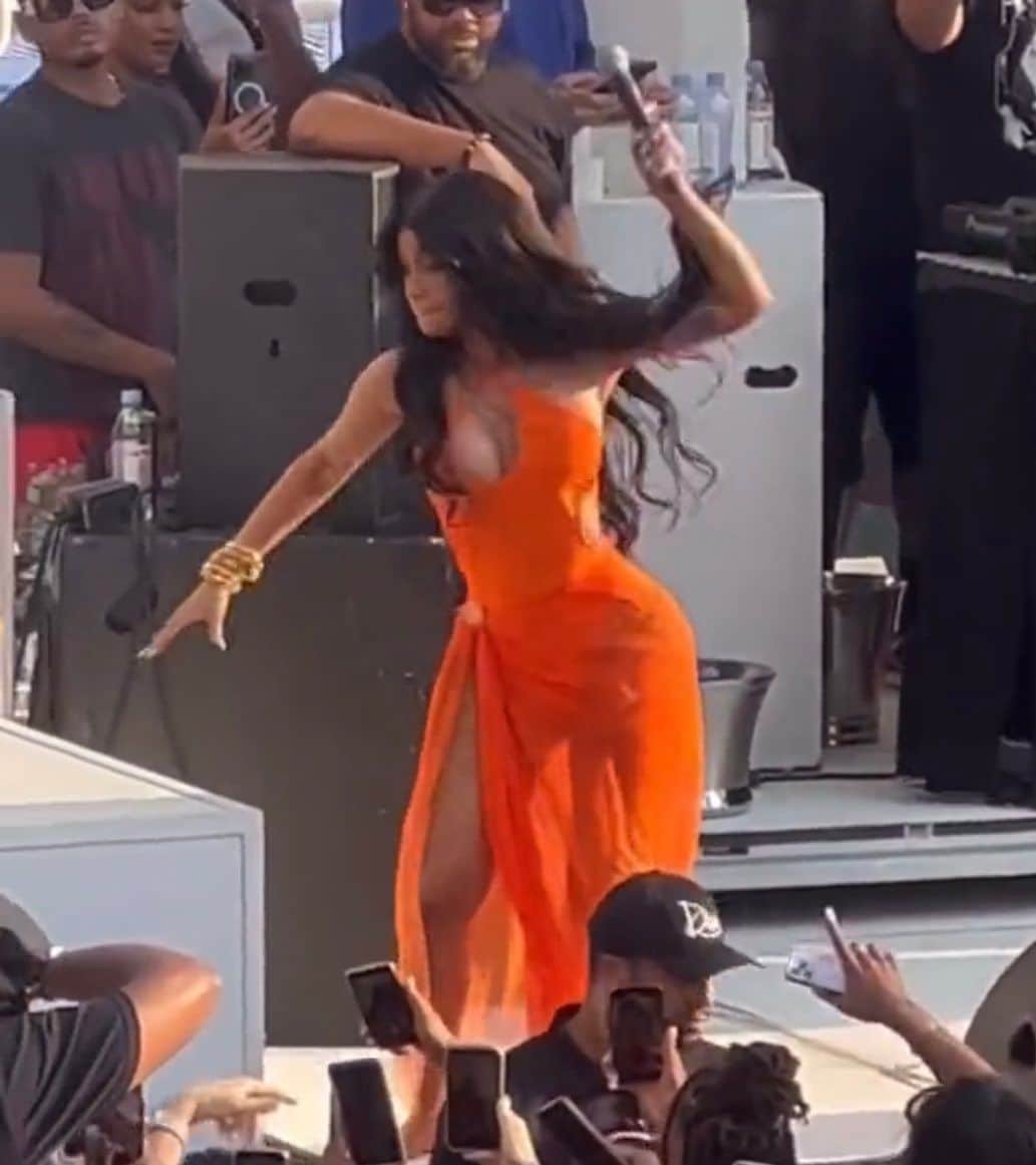 Cardi hurled the mic after asking fans to throw water, but not on her face