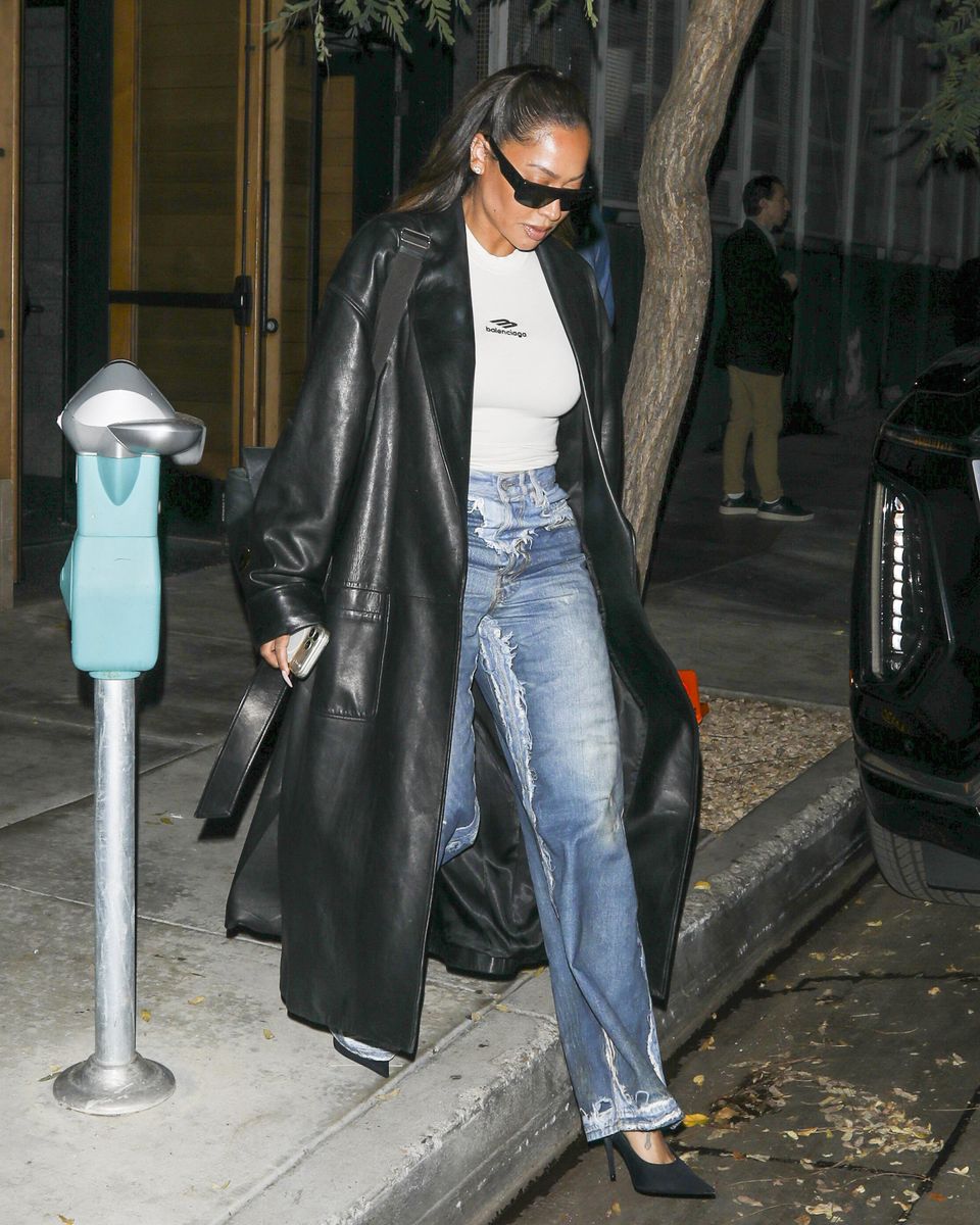 La La Anthony embraced an edgy fall look, pairing an oversized black leather coat with a white Balenciaga T-shirt and distressed jeans.