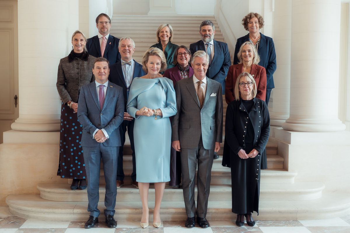 Queen Mathilde of Belgium makes a stylish statement in a powder-blue dress featuring sculptural shoulder detailing during a reception at the Castle of Laeken.
