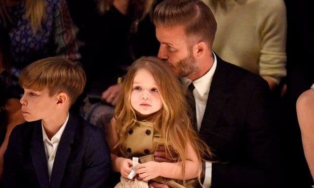 David sweetly kissed his 3-year-old daughter on the head at Burberry's 'London in Los Angeles' show in April 2015. Harper, whose light-brown locks matched her Burberry dress, attended the show with her whole family, but stayed close to daddy.
Photo: Getty Images