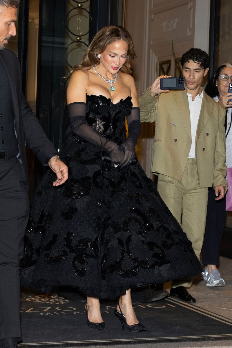 Lopez gave the dramatic look a regal finishing touch with sheer black opera gloves and sparkling statement jewelry.