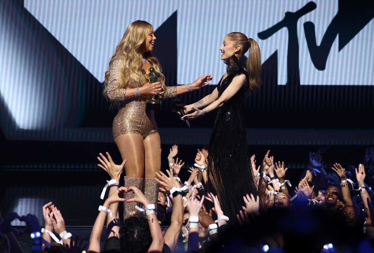 Ariana Grande presents Mariah Carey with the Michael Jackson Video Vanguard Award during the 2025 MTV Video Music Awards